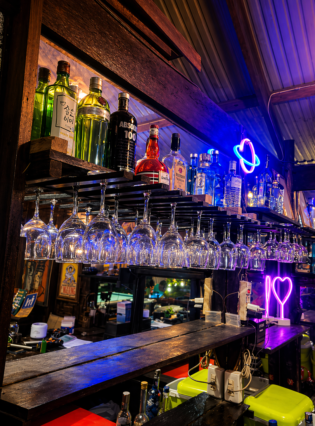 Bar shelf with neon lights at La Luneria
